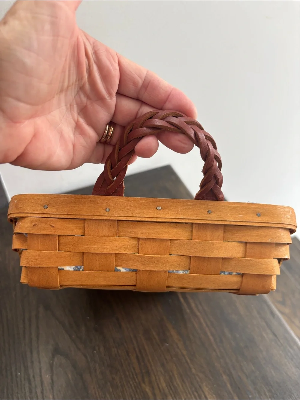 Longaberger basket 2008 w/ blue cloth lining, woven leather handles, 10.5x15x3”